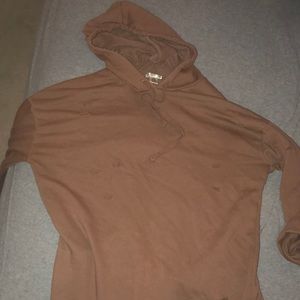Brown colored hoodie with holes
